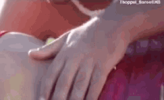 a close up of a person 's hand on another person 's back .