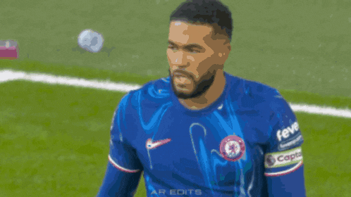 a soccer player wearing a blue shirt that says fedex