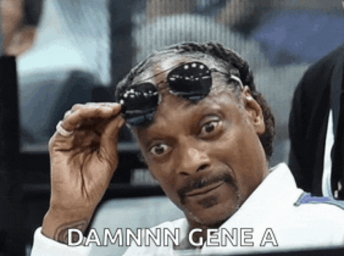 snoop dogg wearing sunglasses and a white shirt says damnn gene a