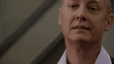 a close up of a man 's neck and ear with his eyes closed