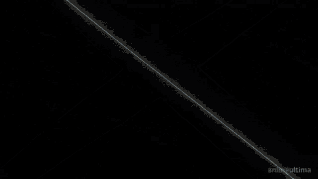 a white light beam is crossing a black background .
