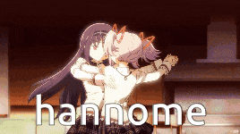a picture of two anime girls hugging with the word hannome on the bottom right