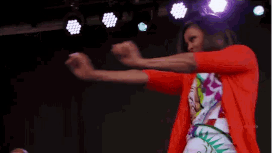 a woman is dancing on a stage with the hashtag #stycdpremiere