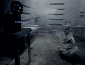 a black and white photo of a dimly lit room