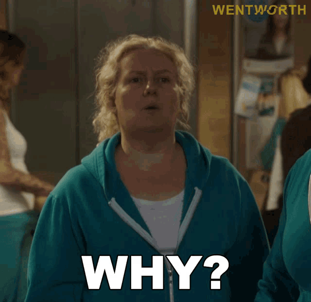 a woman in a blue sweatshirt is asking the question why