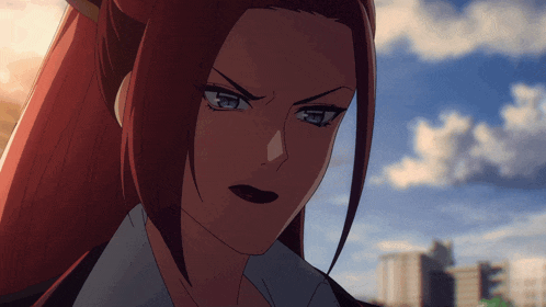 a close up of a woman 's face with red hair and blue eyes