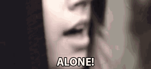 a close up of a woman 's face with the words `` alone '' written below it .