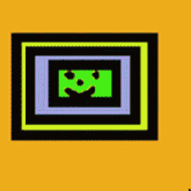 a picture frame with a green smiley face in the center