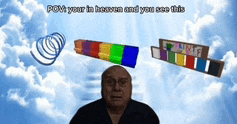 a man stands in front of a cloudy sky with a rainbow colored object on his head