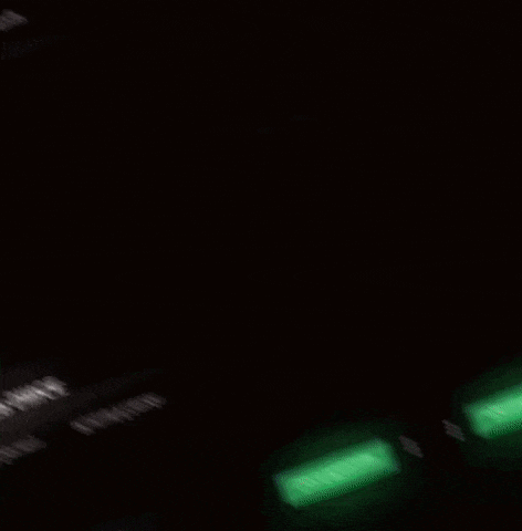 a blurred image of a person 's face on a computer screen with a green button .