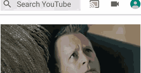 a man is laying on a couch and looking at the camera with the words search youtube below him