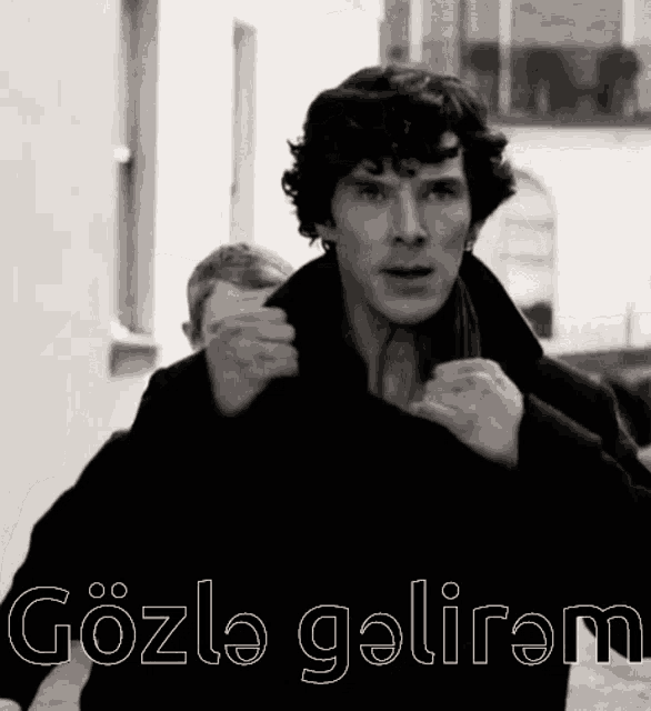 a black and white photo of a man with the words gözle galiram written on the bottom