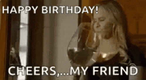 a woman is drinking a glass of wine and saying happy birthday .