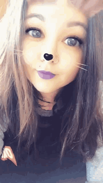 a girl with purple lipstick and a nose ring