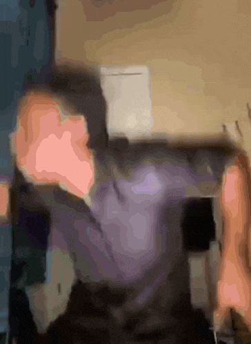 a blurry picture of a person 's face with a white box in the background