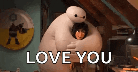 a cartoon character from big hero 6 is hugging a boy in a room .