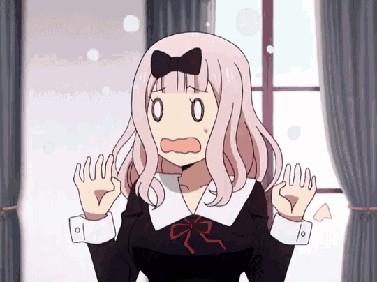 a girl with pink hair and a bow on her head has a shocked expression on her face