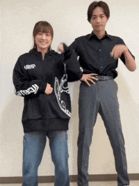 a man and woman are standing next to each other