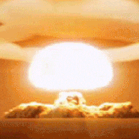 a nuclear explosion with a huge mushroom cloud coming out of the ground .