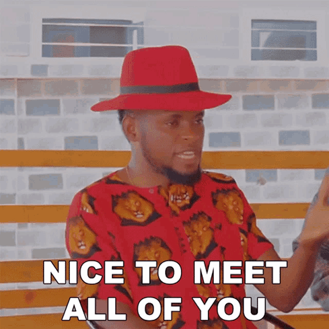 a man wearing a red hat and a red shirt says " nice to meet all of you "