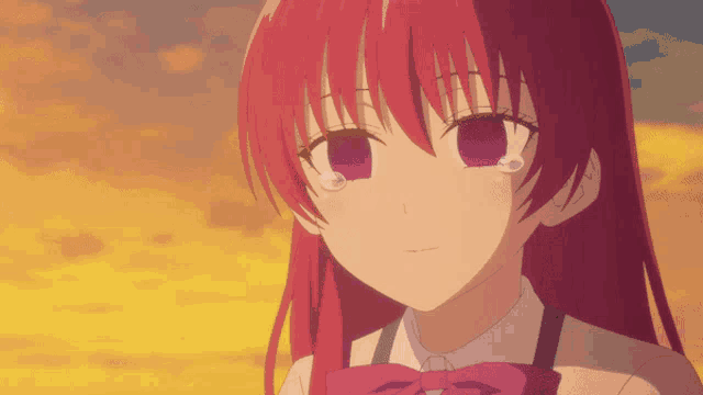 a close up of a girl with red hair and a bow tie