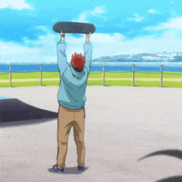 a man in a blue hoodie is holding a skateboard in his hands