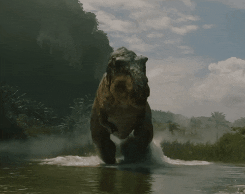 a large dinosaur is running through the water