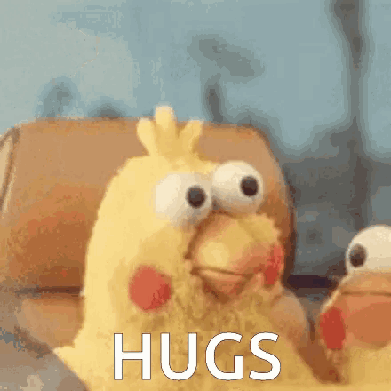 a stuffed chicken with big eyes is sitting in a chair and says hugs .