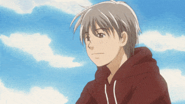 a boy in a red hoodie is looking at the sky