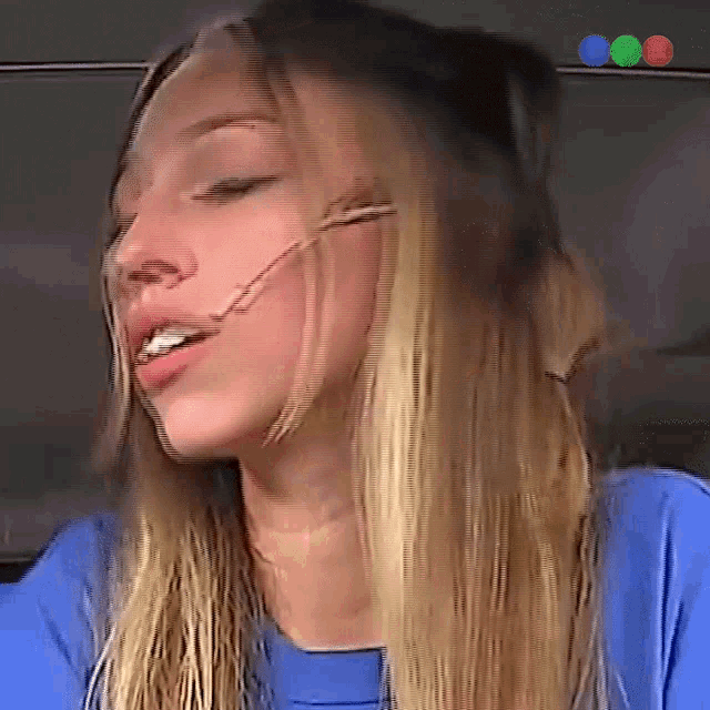 a close up of a woman 's face with headphones on