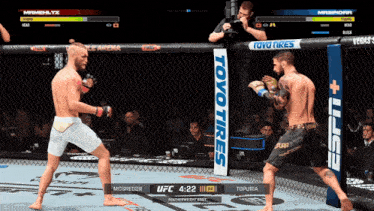 two fighters are fighting in a cage with a toyo tires sign in the background