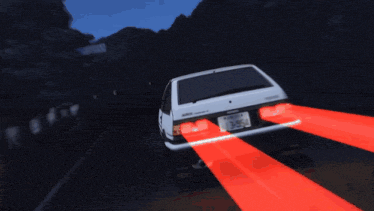 a trueno car is driving down a dark road