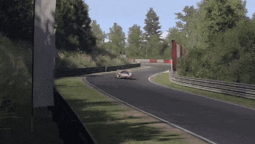 a race car is going around a curve on a race track
