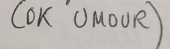 the word ok is written in black marker on a white surface