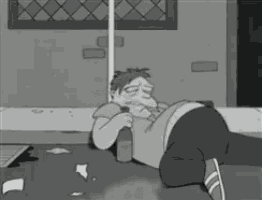 a cartoon character is laying on the ground with a bottle in his hand
