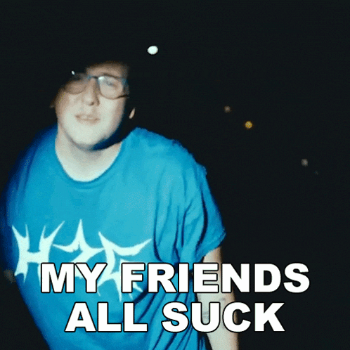 a man with glasses and a blue shirt says my friends all suck