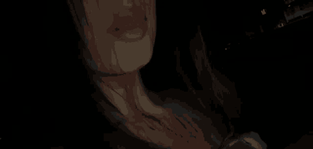 a close up of a woman 's neck with blood on it .