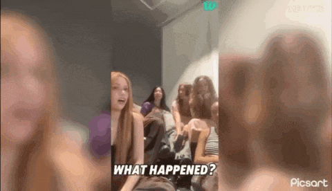 a group of girls are sitting on a couch and laughing .