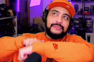 a man wearing headphones and an orange nike shirt