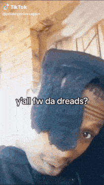 a man with a black hat on his head says y'all fw da dreads ?