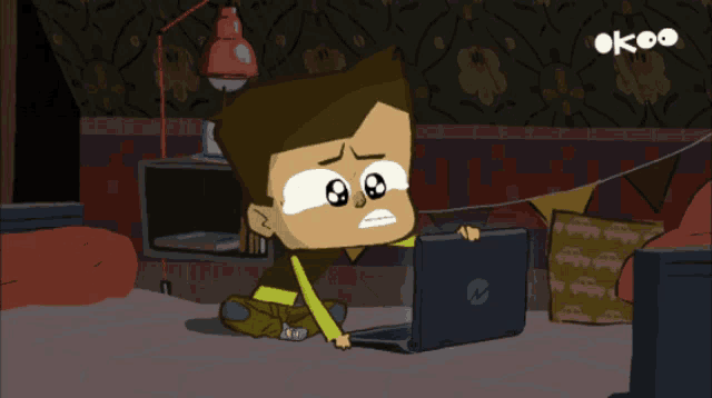 a cartoon of a boy sitting in front of a laptop with the letters ok on the bottom