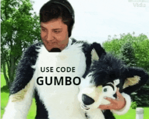 a man in a fursuit is holding a stuffed animal that says " use code gumbo "