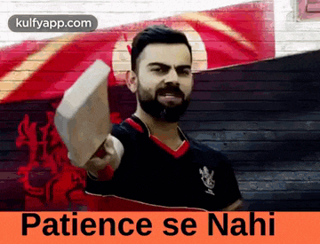 a man with a beard is holding a cricket bat in front of a brick wall and says patience se nahi