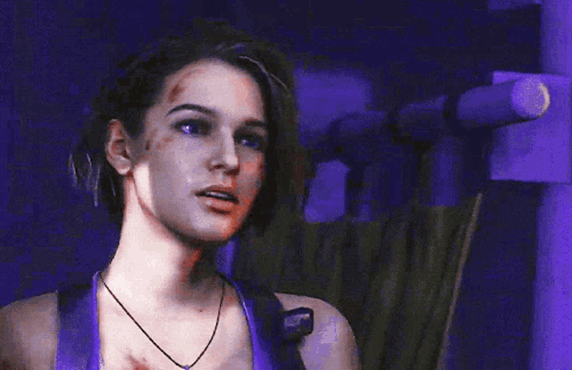 a woman with purple hair and a purple tank top