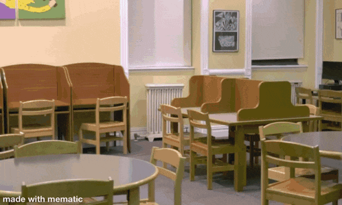 a room with tables and chairs with the words made with mematic on the bottom