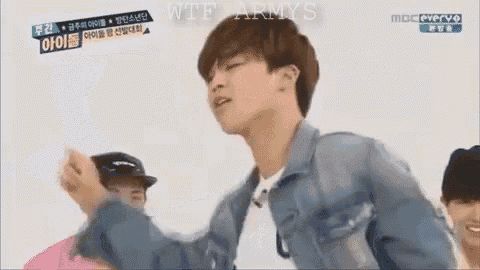 a young man is dancing in front of a group of people and says `` feel so good '' .