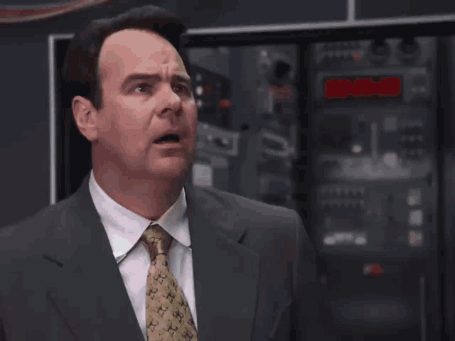 a man in a suit and tie says you 've gotta be shittin