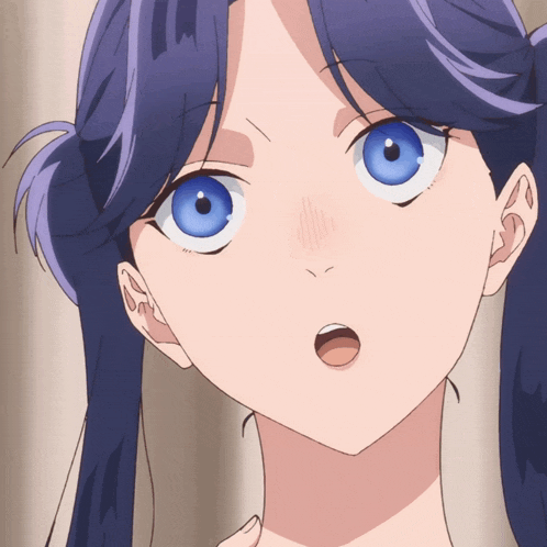 a close up of a girl 's face with blue hair