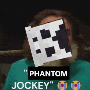 a man with a beard is wearing a blue shirt that says phantom jockey on the bottom