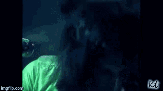 a close up of a person singing into a microphone